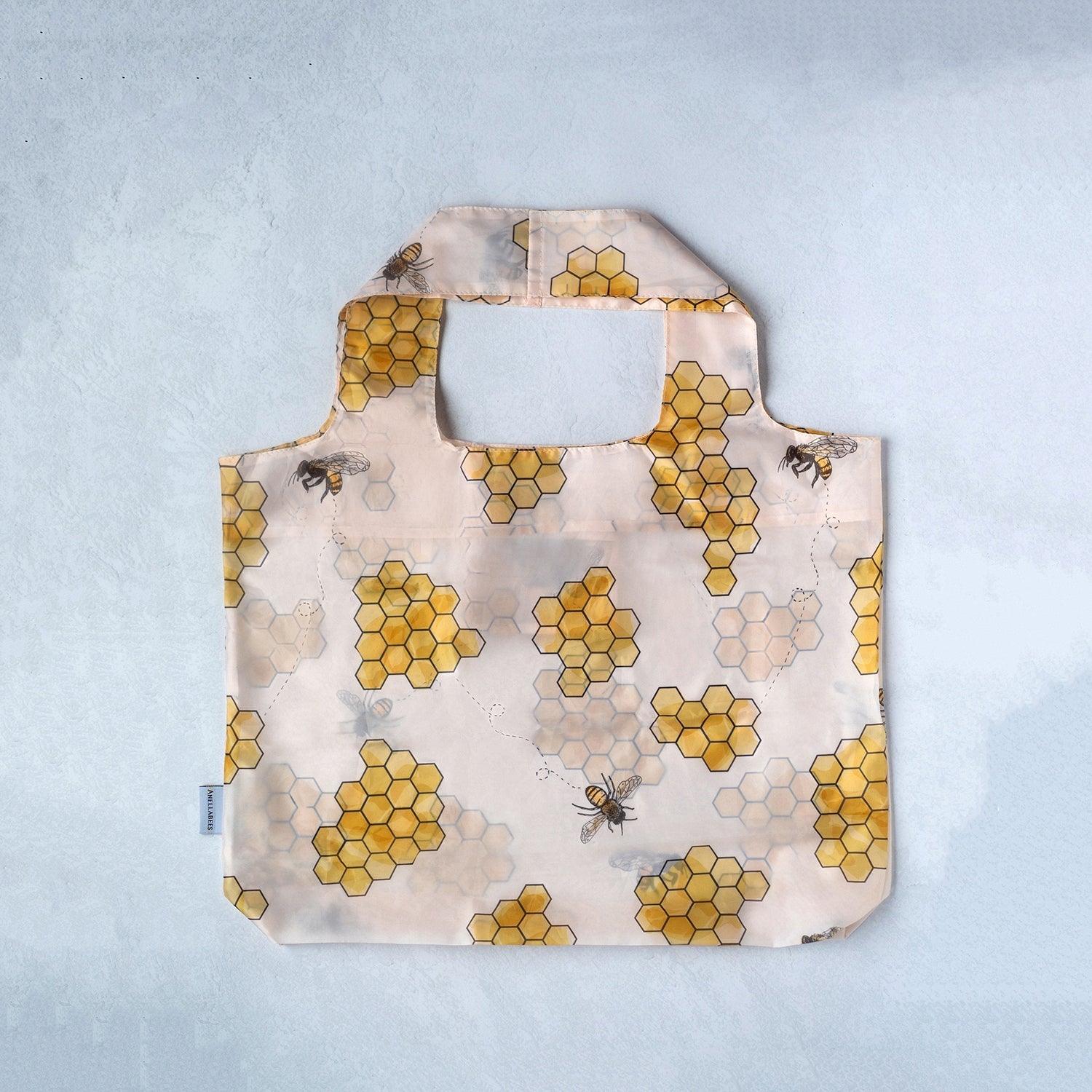 Honeycomb shopping bag, eco-friendly and durable, supports pollinators, perfect for sustainable shopping and promoting bee conservation
