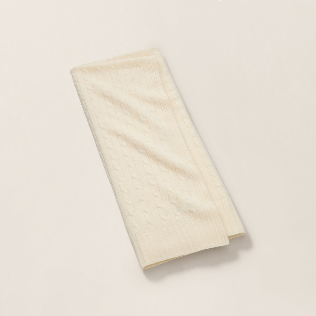 The Iconic Cable Cashmere Throw Blanket in Cream